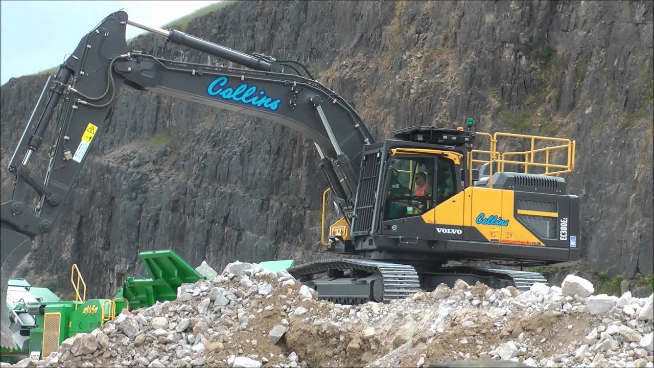 Volvo EC380EL Excavator loading a crusher.