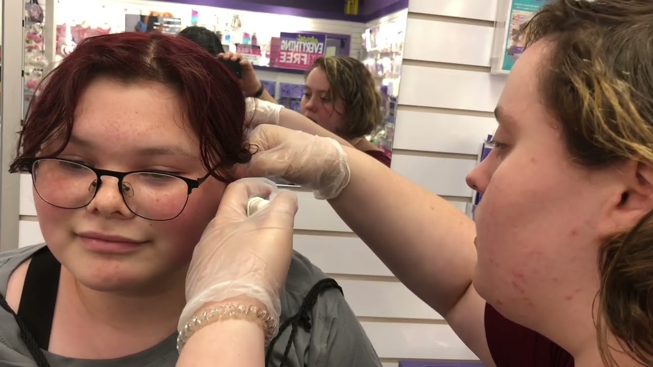 Watch What She Does!!! Getting ears pierced at Claire’s.