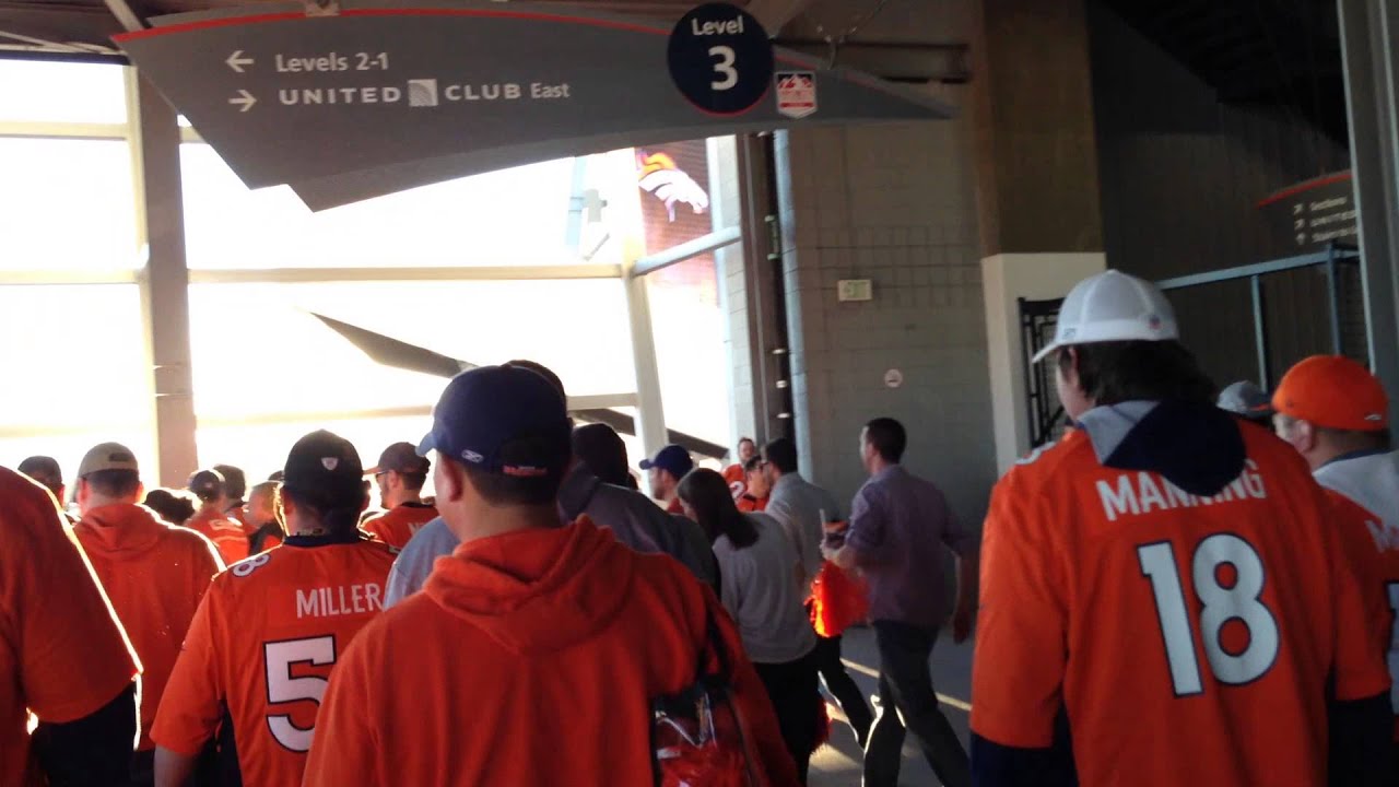 Excited fans in Mile High Stadium after the Broncos defeat the Patriots on 1/19/14