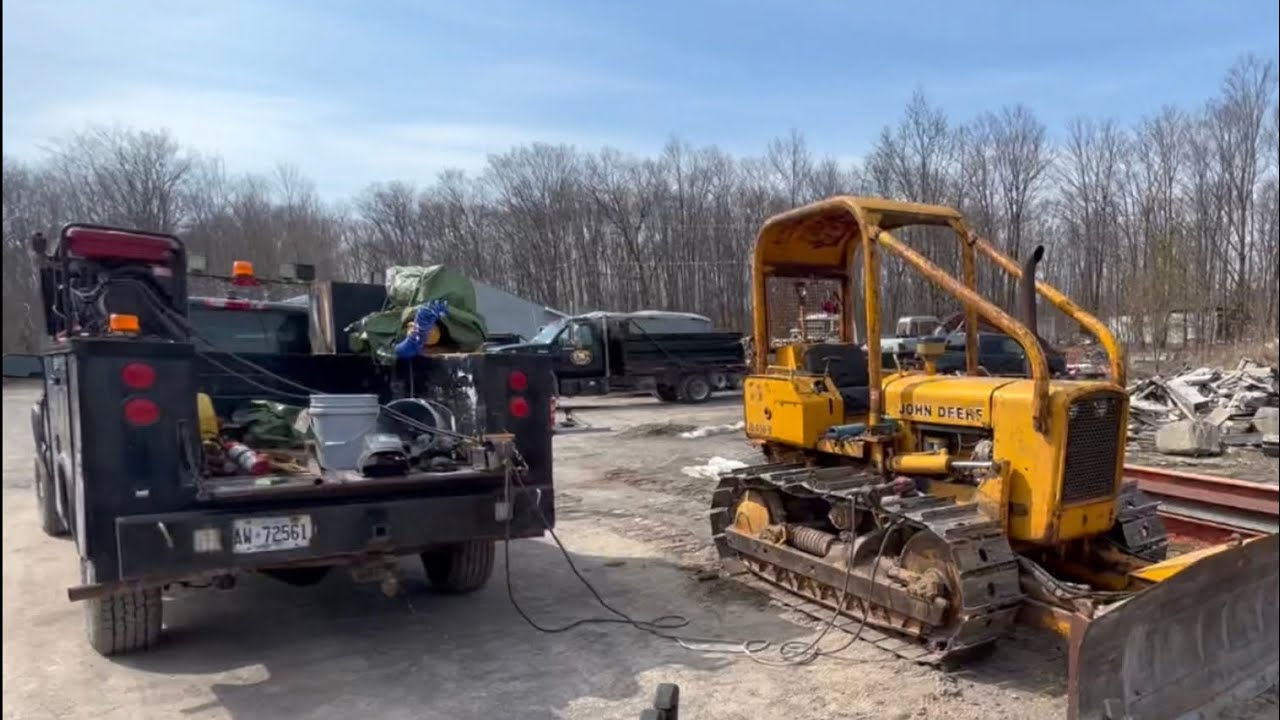 Welding grousers on John Deere 450B dozer