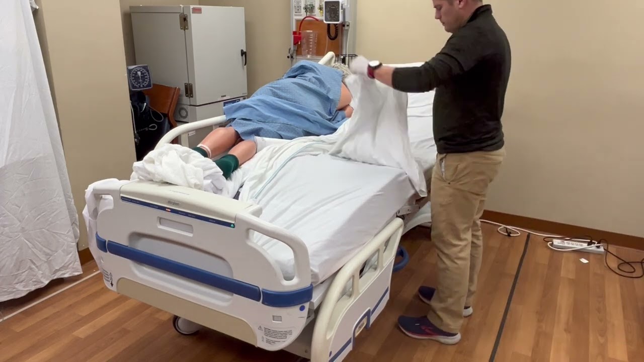 Basics of Patient Care: Changing Sheets On An Occupied Bed