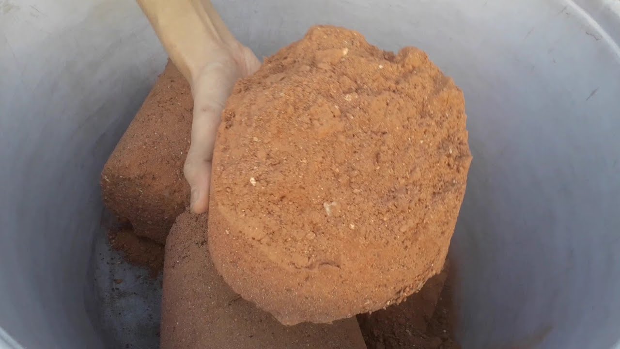 Red dirt chunks crumbling short ASMR video 