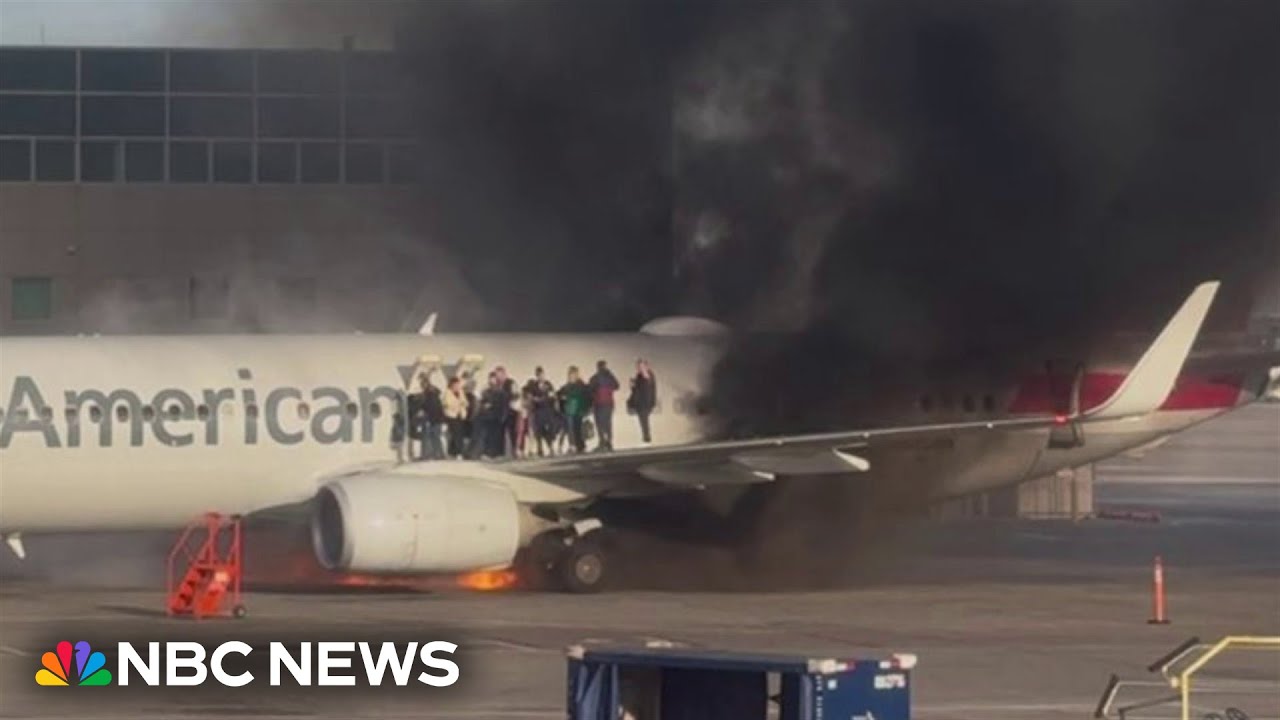 American Airlines plane catches fire at Denver International Airport