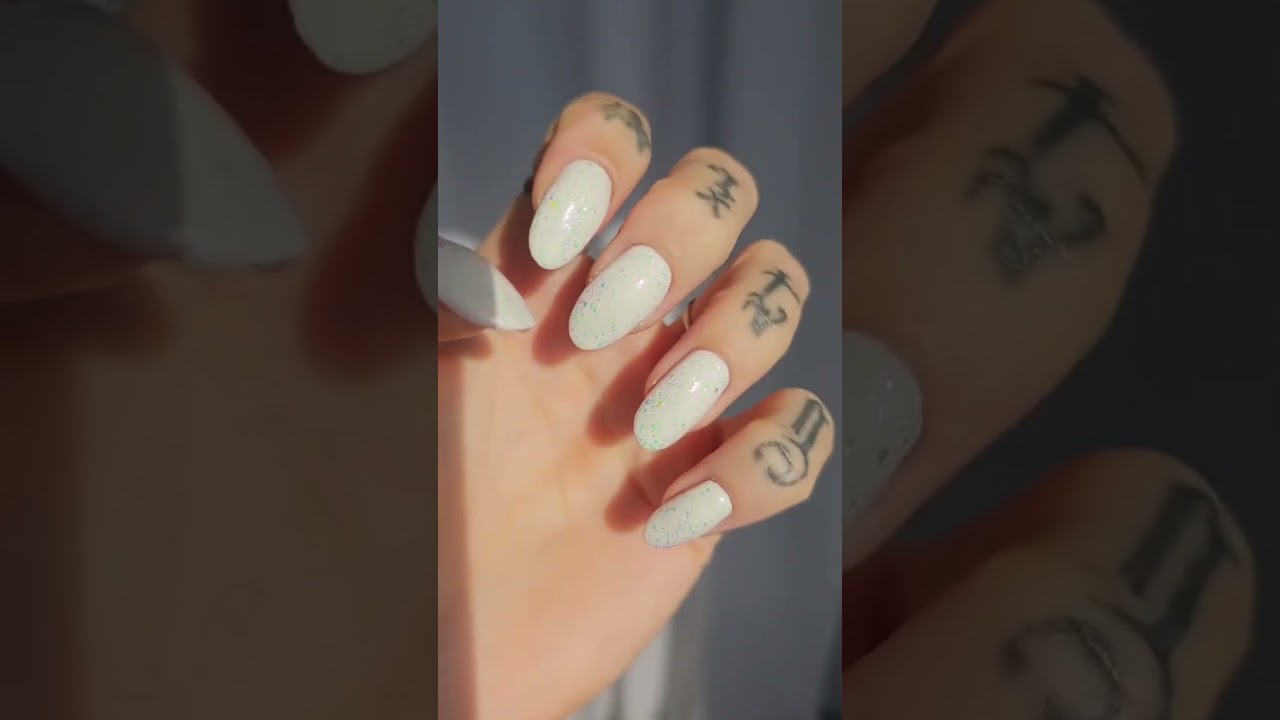 Opal nails glowing like my breastmilk ring—so much shine! 