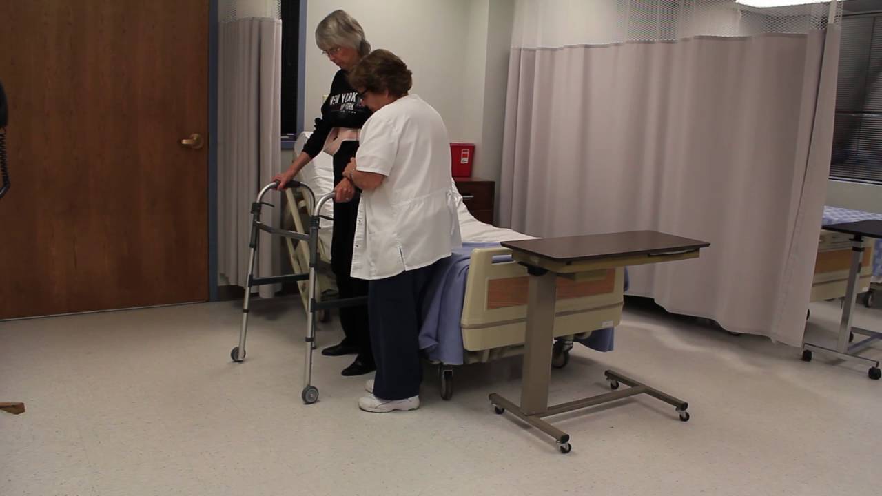 Assisting with ambulation for a resident using a walker