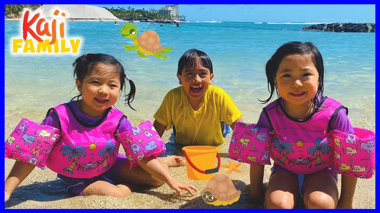 Family Fun at the Beach in Hawaii and playing in the sand!