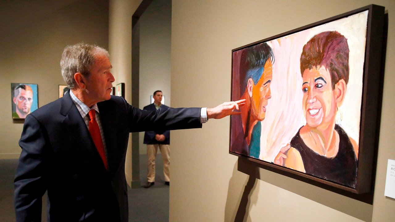 Former President George W. Bush gives a tour of his gallery of Warrior oil paintings
