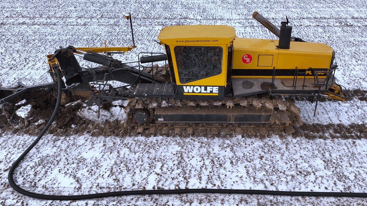 Big Tile Plow Runs Through The Frost