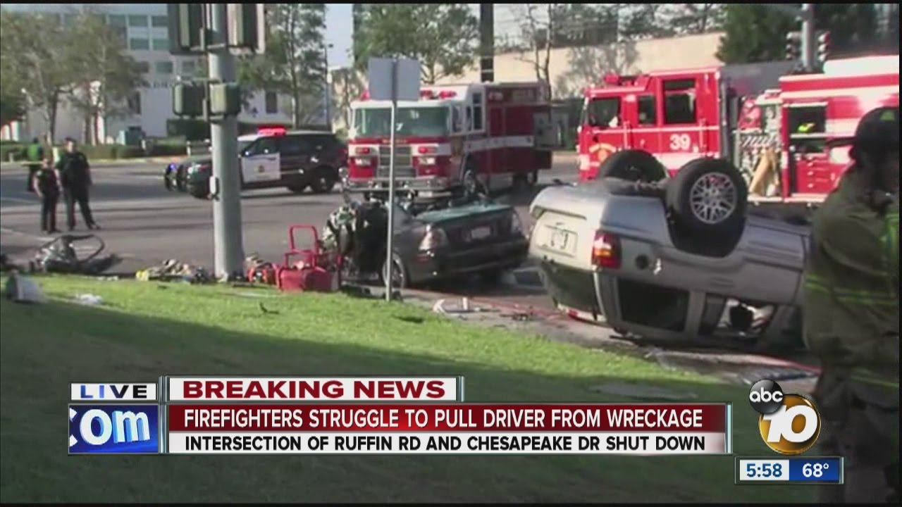 Firefighters struggle to pull driver from wreckage