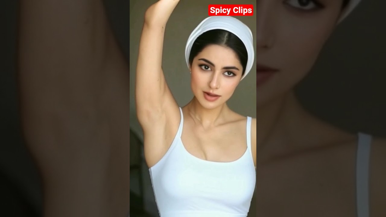 Showing clean underarms. Beautiful girl. Nice figure.