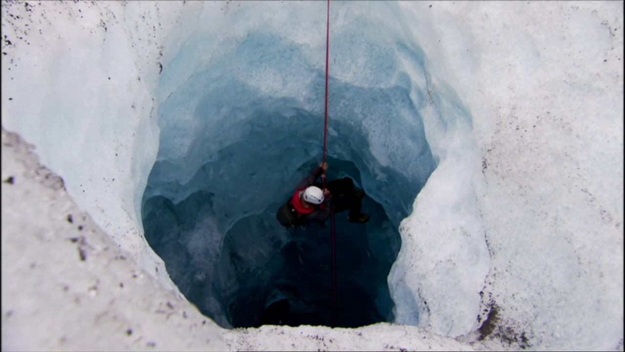 Exploring the ice caves at the base of a glacier