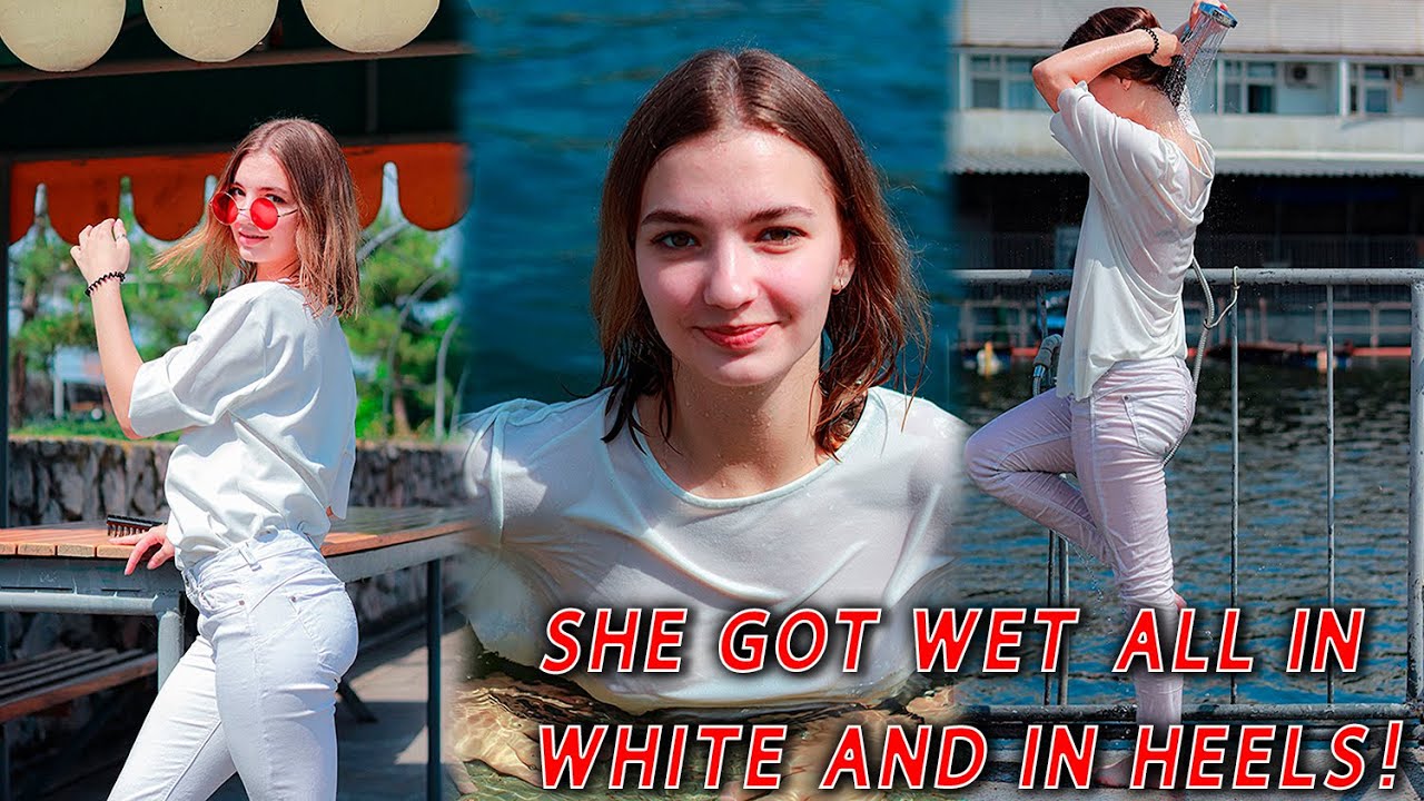 She got wet all in white and in heels! Looked hot wetlook