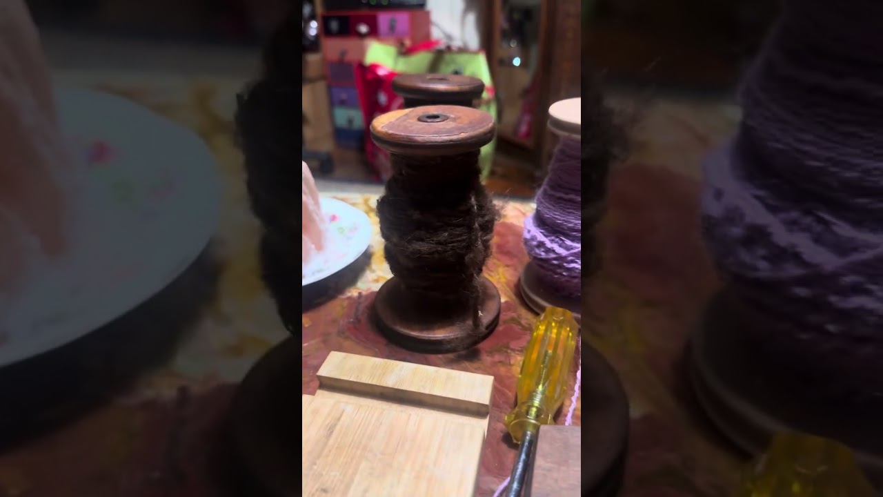 Playing at spinning wool from my dead cat “Socks”