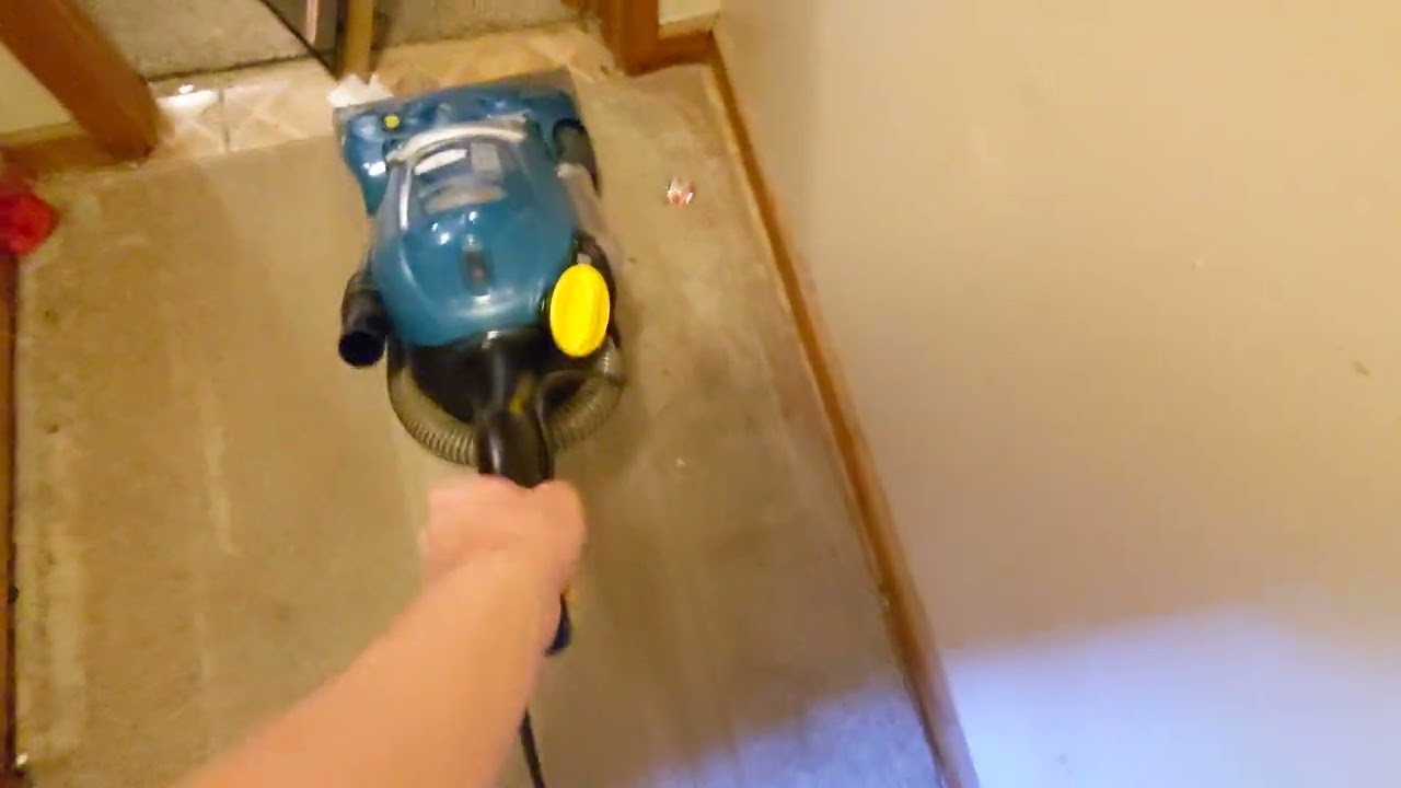 Eureka The Boss Smart Vac Vacuuming Very Dirty Rug.