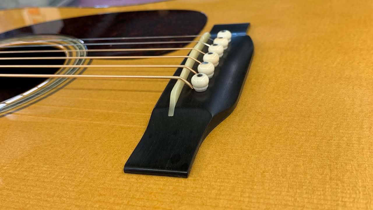 Guitar making: cutting a saddle slot, making a bone saddle and stringing up for the first time