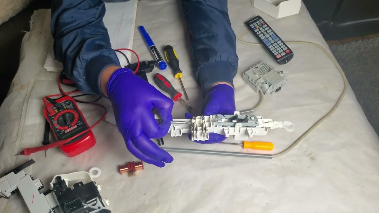 Fixing washer door lock - كيفية اصلاح قفل الغسالات