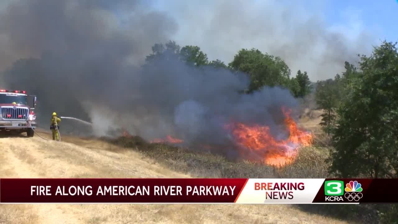Fire burns along American River Parkway in Sacramento County