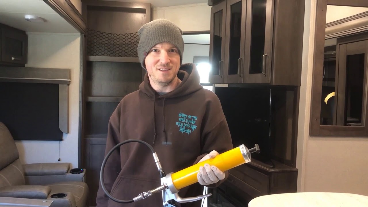 Greasing a Dexter suspension on a Grand Design 311BHS.  Wet Bolt grease