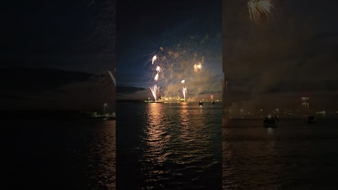 Cunard Queen Anne leaving on her maiden voyage with fireworks and horn salute from smaller boats.