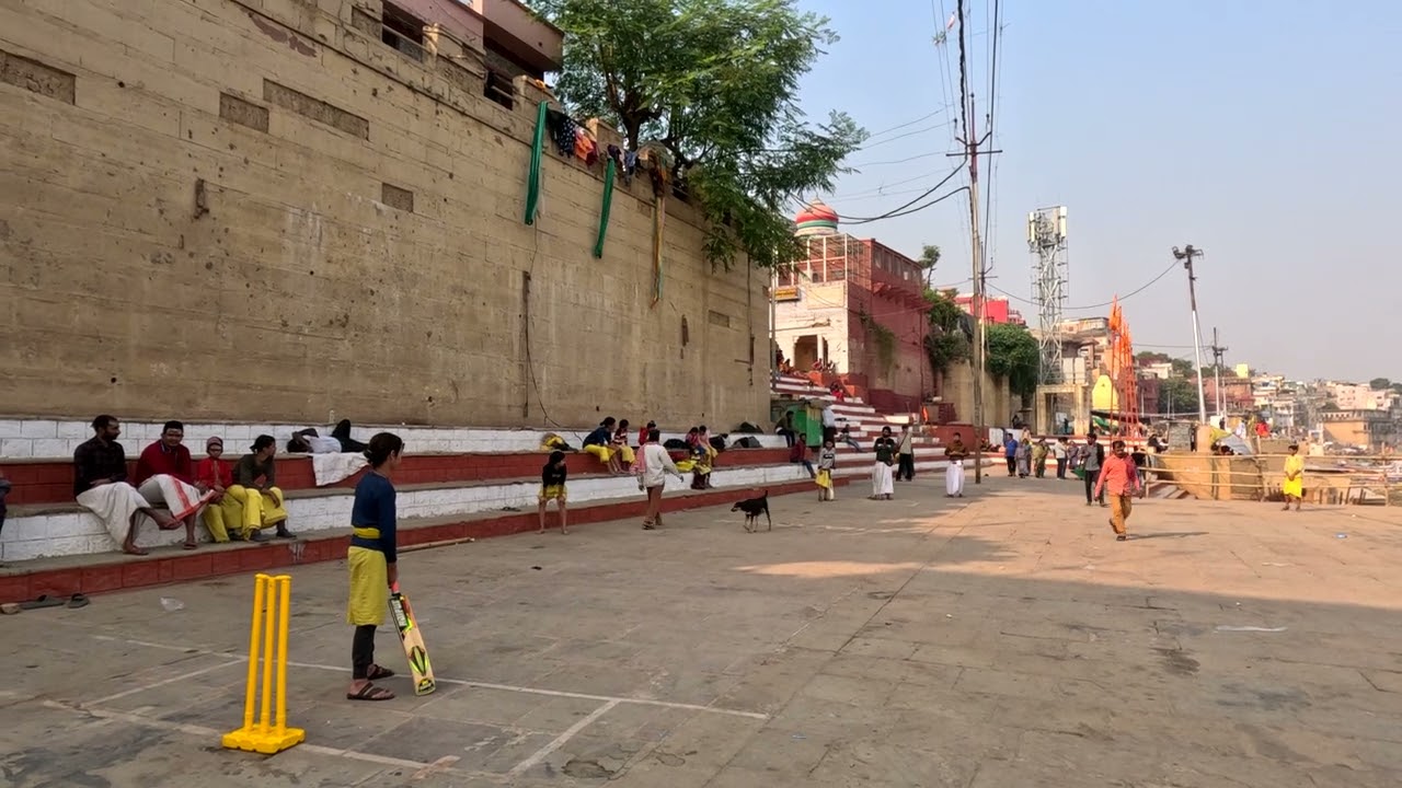 Students from the Vedic School Shri Vidya Math Varanasi playing cricket on sunday at a nearby ghat