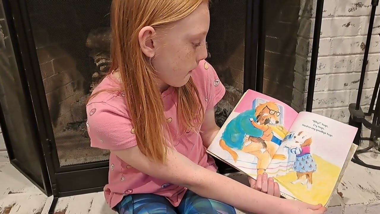 Ginger reads the Hug Book