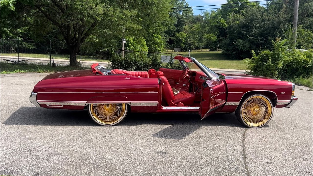72 IMPALA CONVERTIBLE KANDY on 24” 24KT GOLD DAYTONS STAGGERED