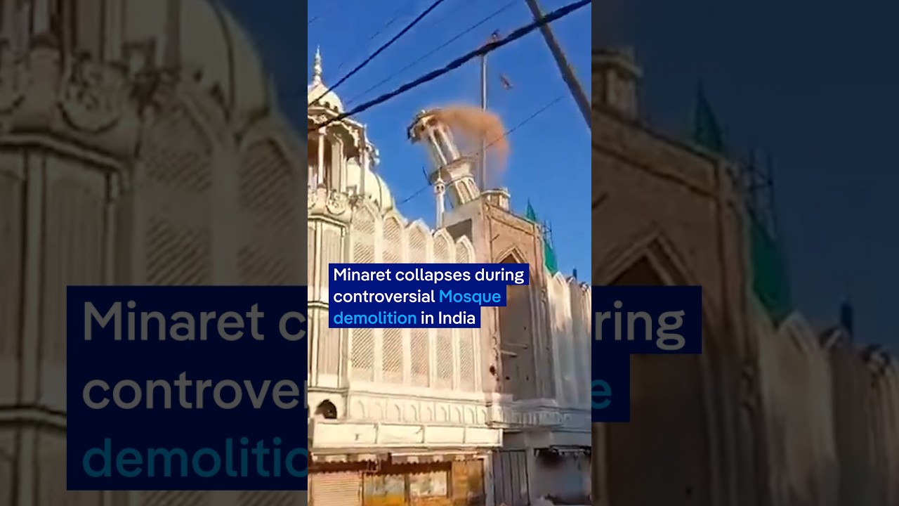 Moment minaret collapses during controversial mosque demolition in India | DW News