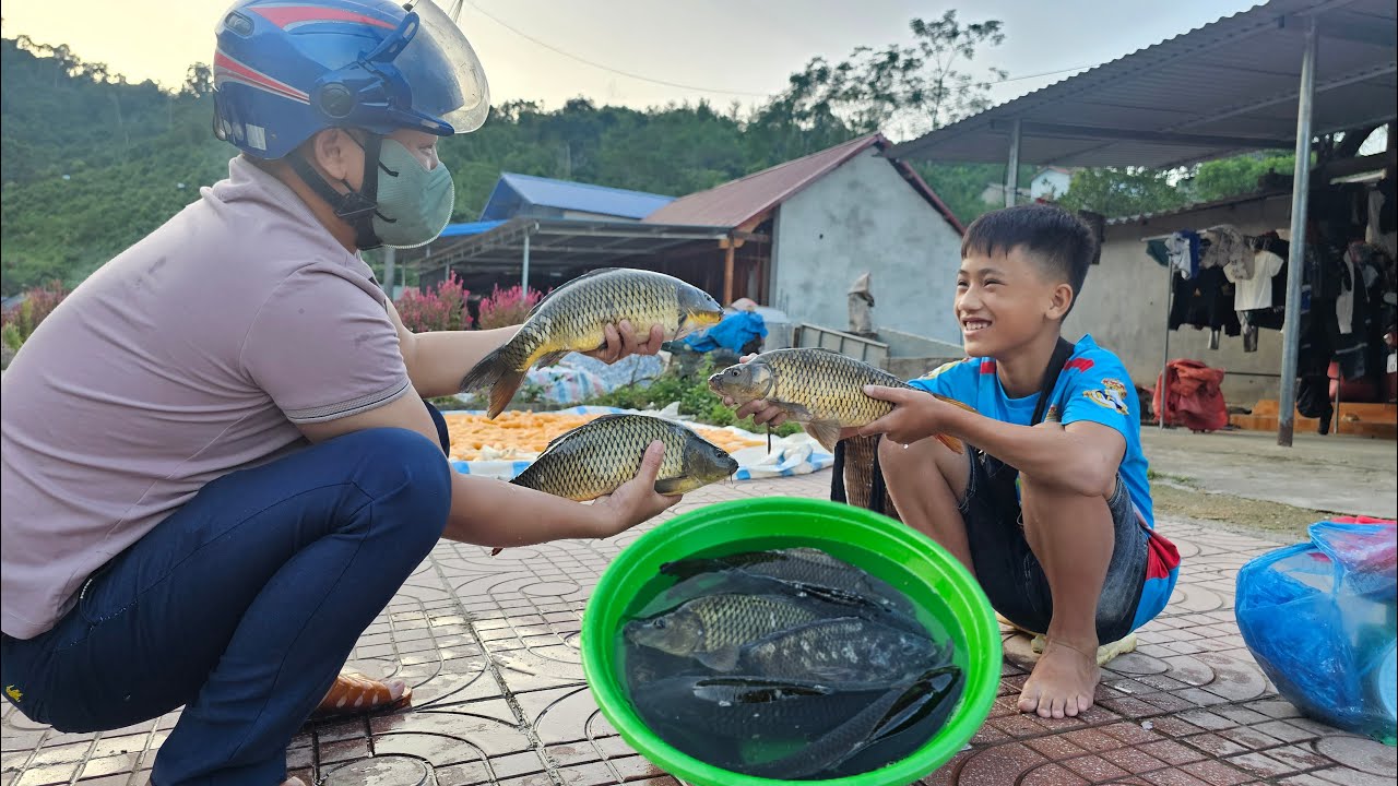 Nam's way of stacking rocks to create fish traps has caught a lot of fish to sell and cook