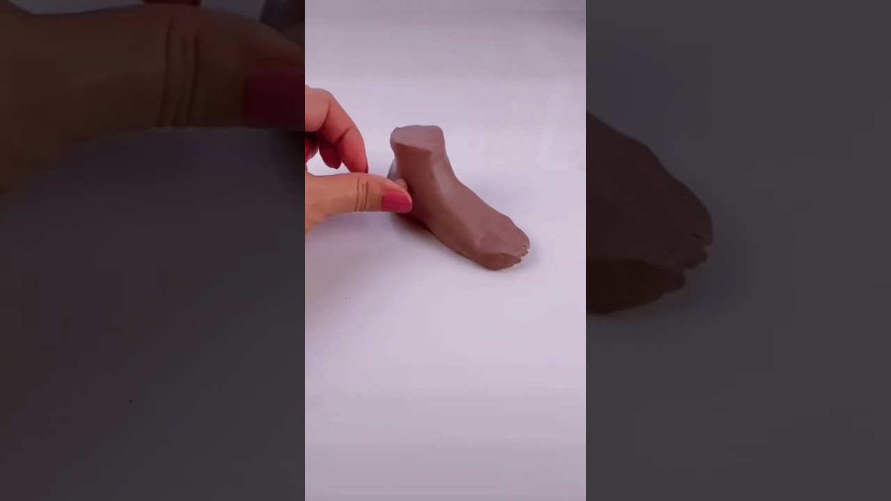 Sculpting a foot with clay