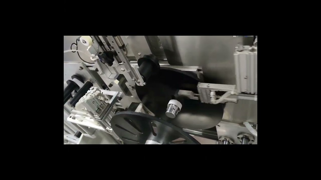 Automatic tape winding machine with cardboard tube inside rolling machine 
