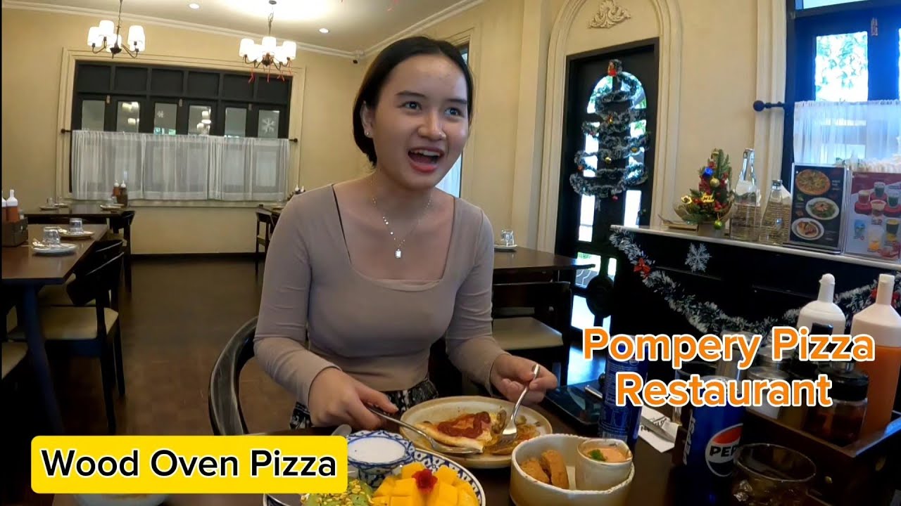 🇱🇦 Annie enjoying her delicious meal at Pompery restaurant 🍕