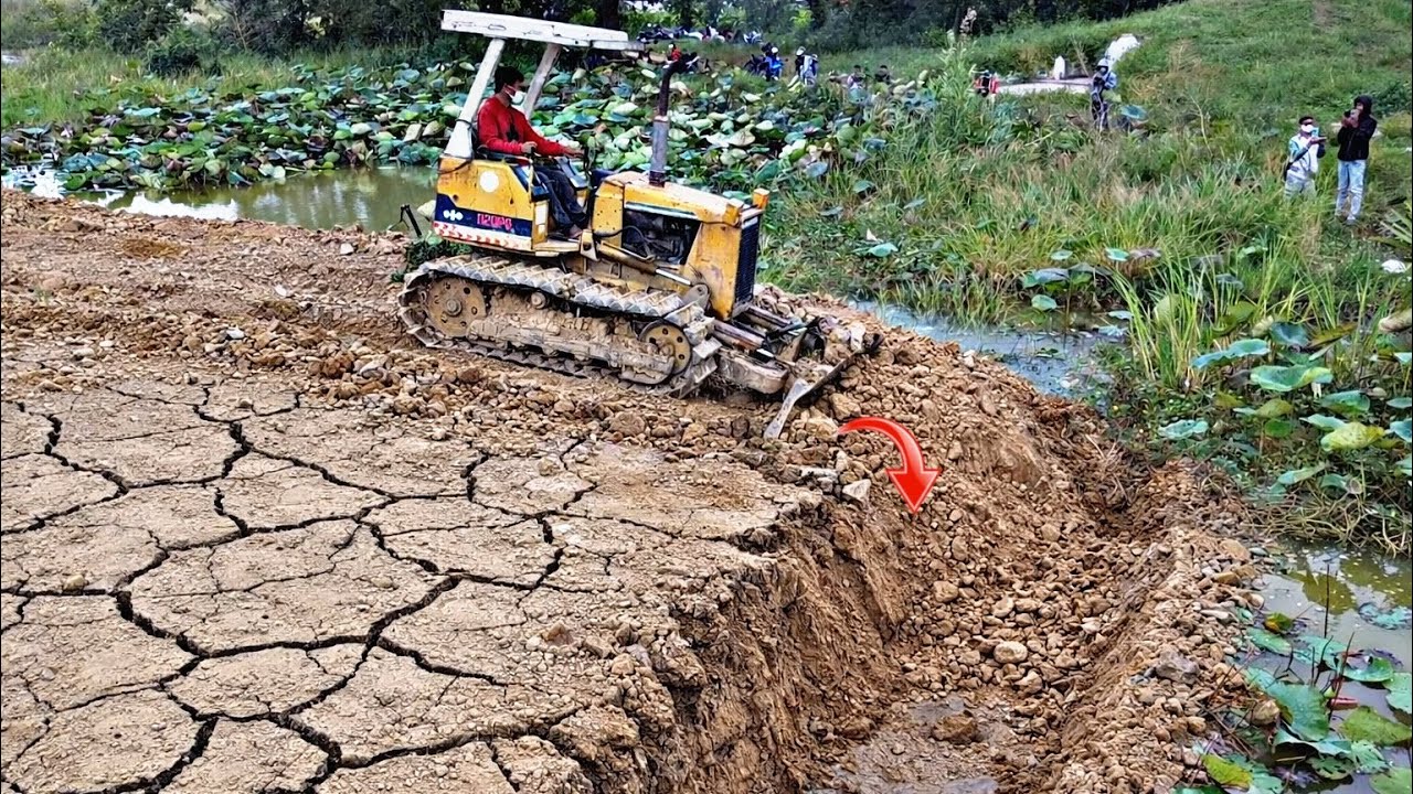 Good job!! Operators By Bulldozer KOMATSU pushing soil Landfill building Road with 5ton Dump Trucks