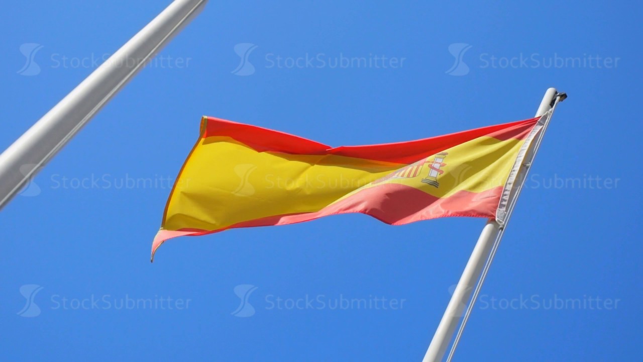 Spanish flag flying on a flagpole