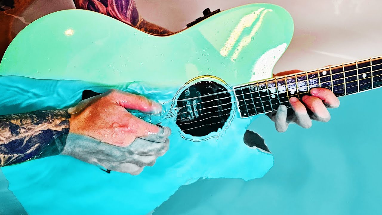 Playing guitar underwater actually sounds HEAVENLY