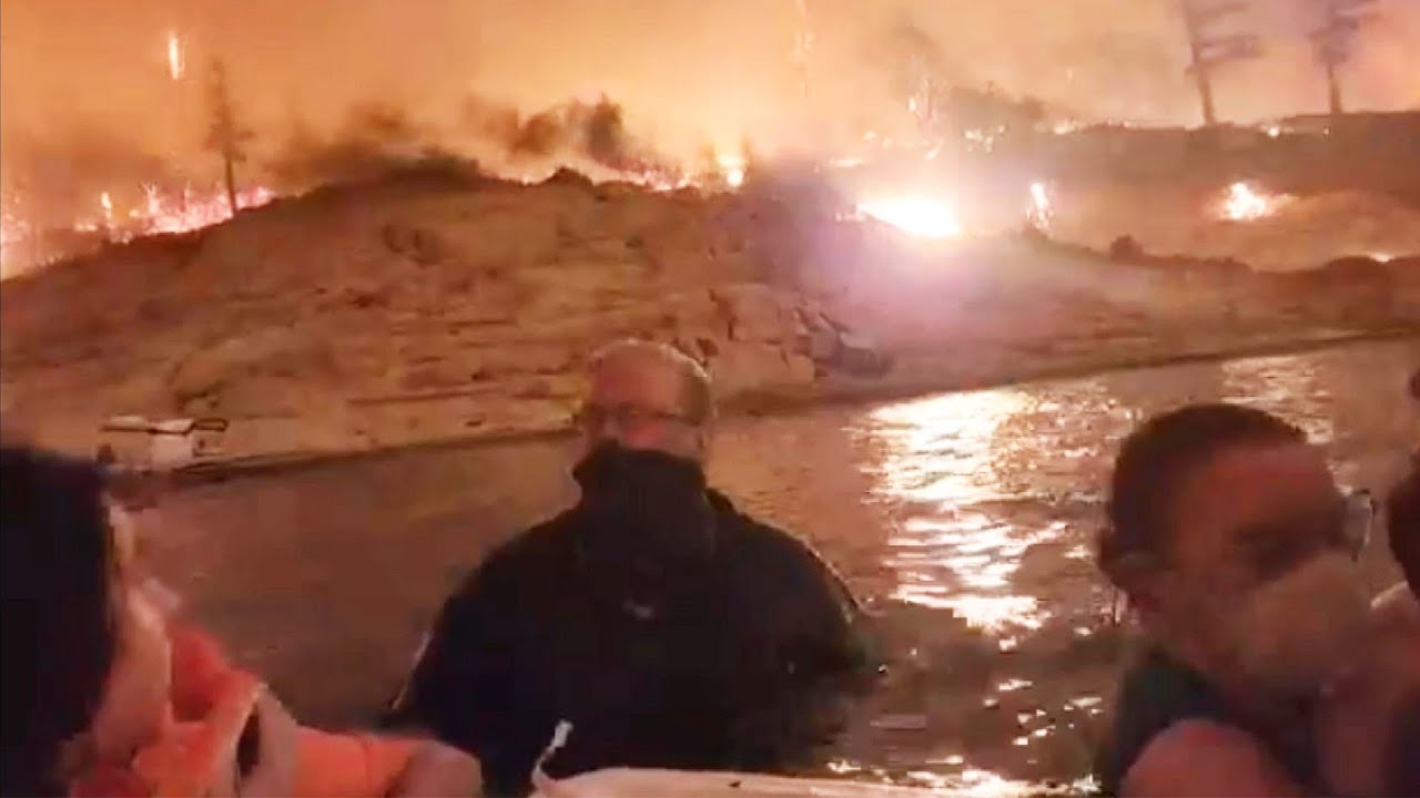Family Shelters in Freezing Lake From California Wildfires