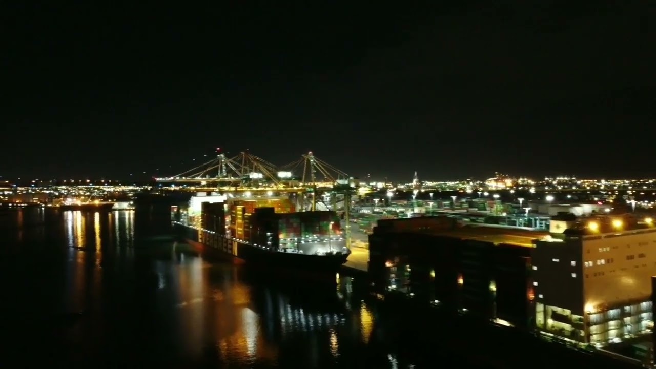 Drone footage of cargo ship port of Los Angeles at night...