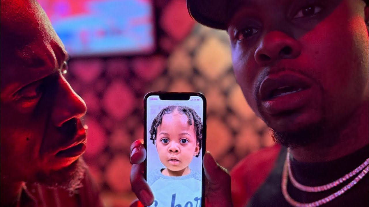 When Ras shows D a picture of his son! 