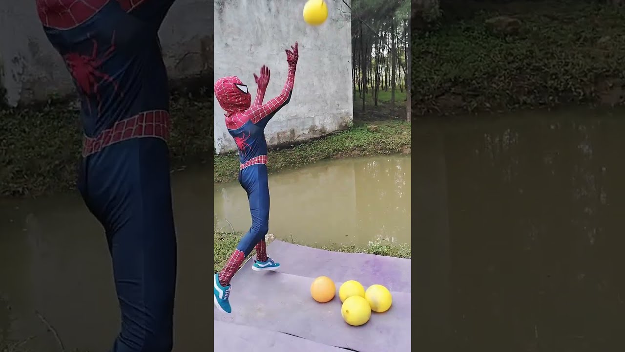 popping water balloon into rain water