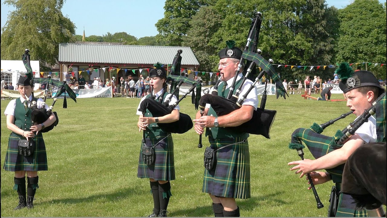 Huntly Pipe Band playing Braes of Killiecrankie during 2023 Oldmeldrum Highland Games in Scotland