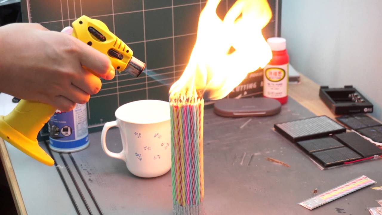 BIG CANDLE on fire, A LOT of birthday candles burn