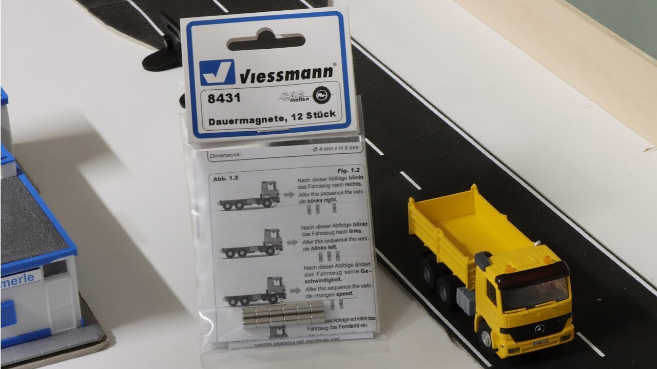 Met Viessmann CarMotion magneten  artikel nr. 8431 kan je commando's  aansturen.