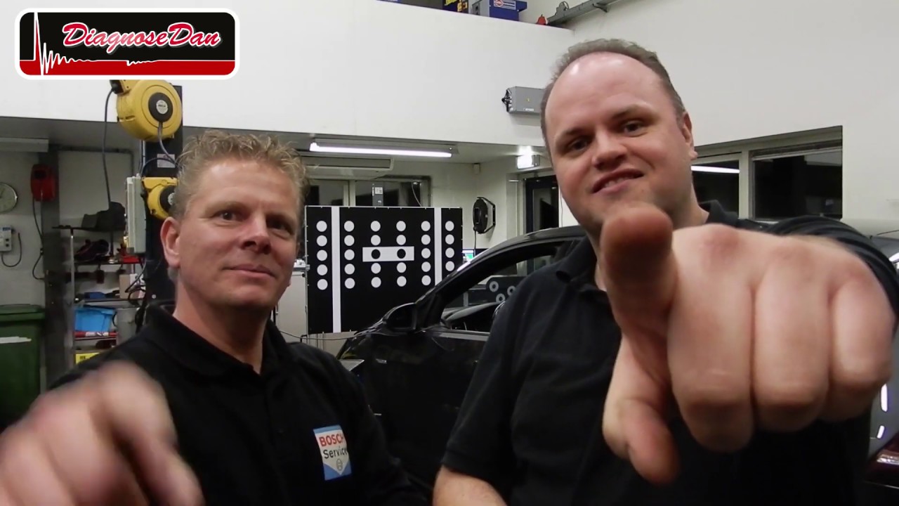 fixing a car with a laptop (ADAS)
