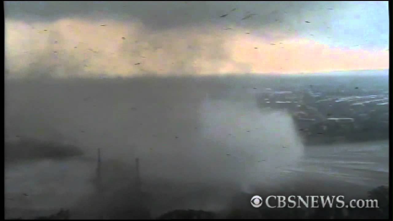 Funnel cloud forms over river