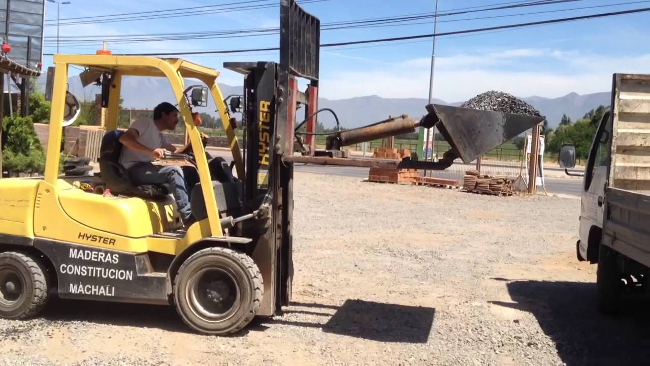 Grúa horquilla con pala
