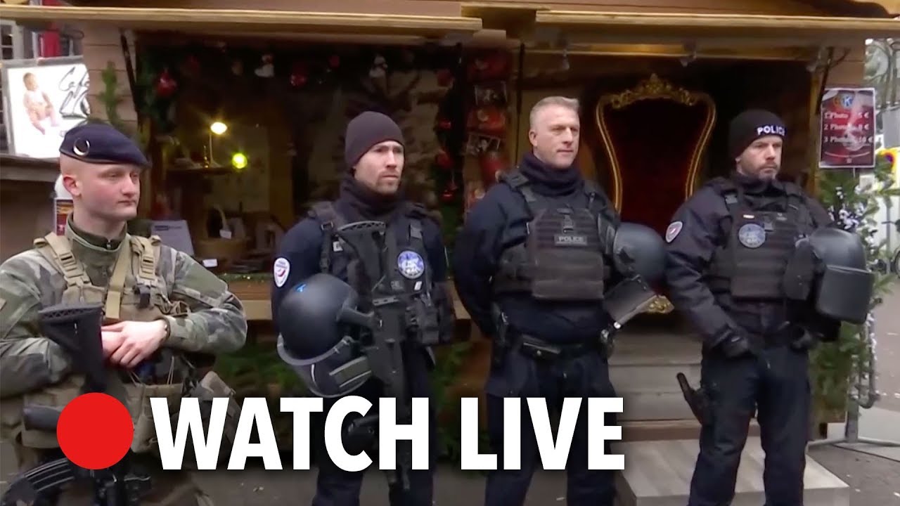 French Interior Minister thanks armed police at Strasbourg Christmas market