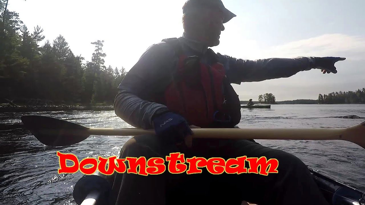 Canoe Fishing Trip Racing Weather heading Downstream Back Country Adventure