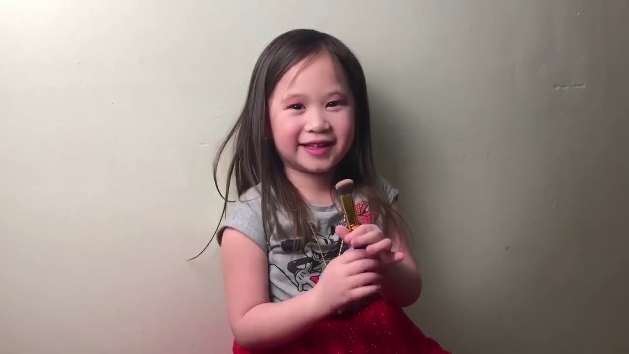 Hmong girl doing a quick makeup tutorial