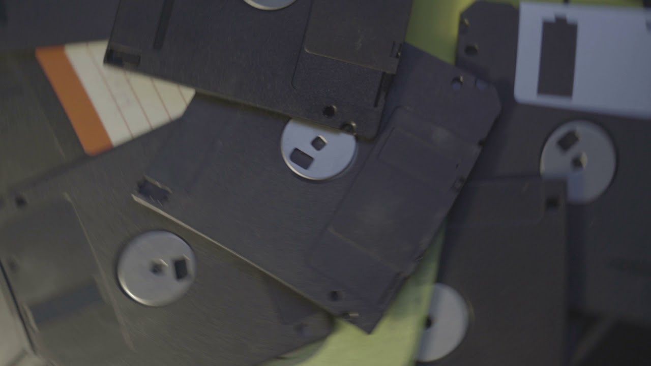 old diskettes data center concept background, pile of floppy discs rotating