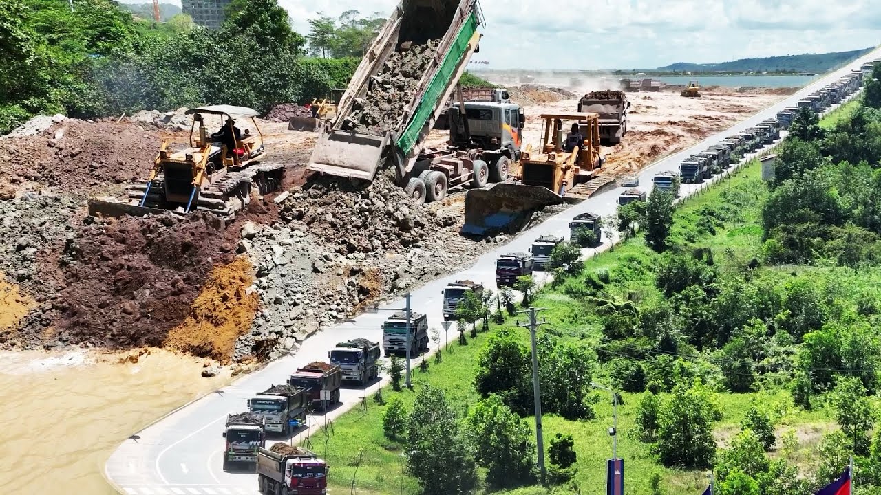 EP3 Dramatic Footage Huge Dump Truck Management Bulldozer Push Stone Land Reclamation Project