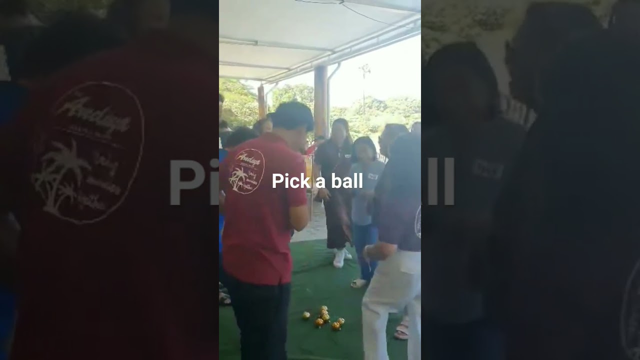 Filipino family reunion game . Pick a ball ! When the music stops , you pick a ball!